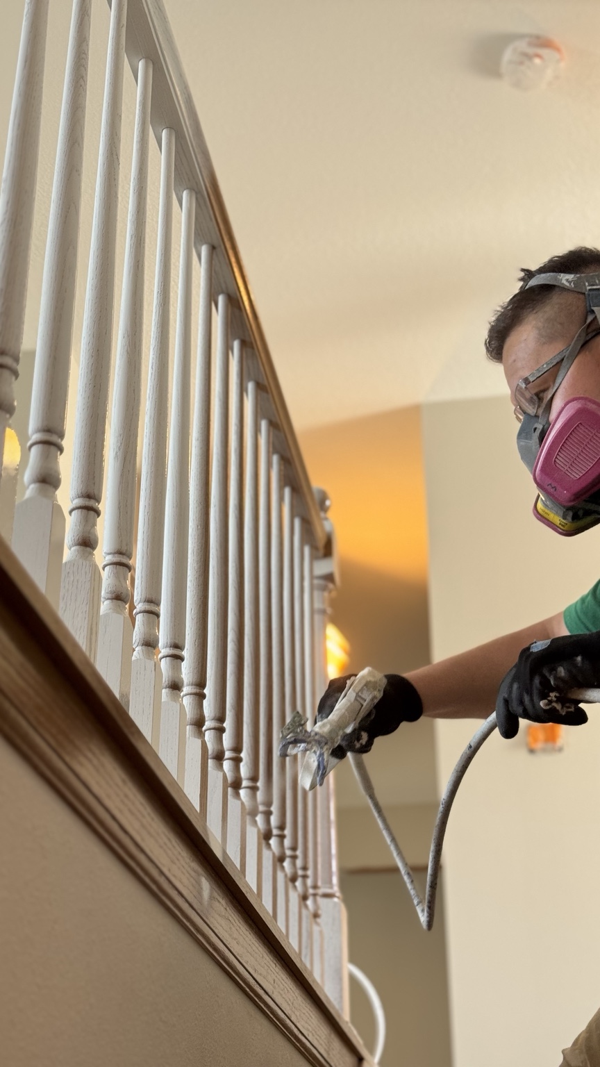HH Home Renovation painting a stair railing